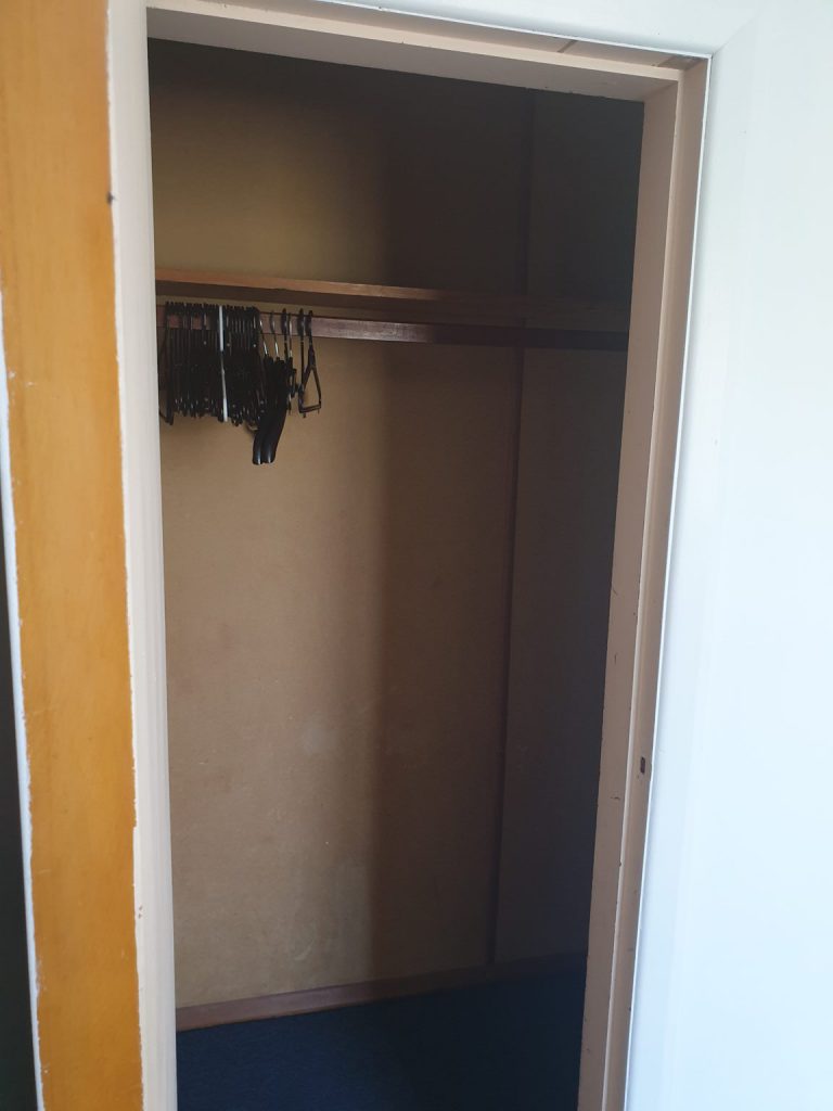 A  photo of an empty closet that does not add value