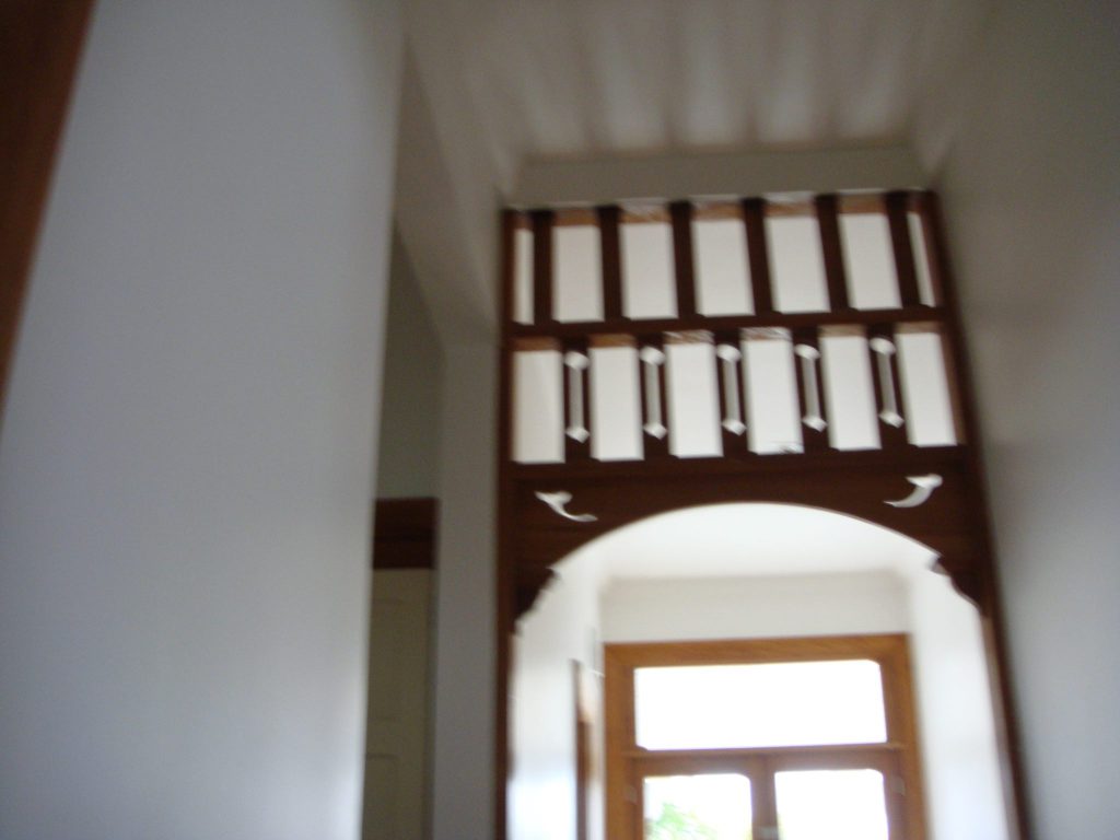 A property listing photo that shows a blurred hallway and does not add value